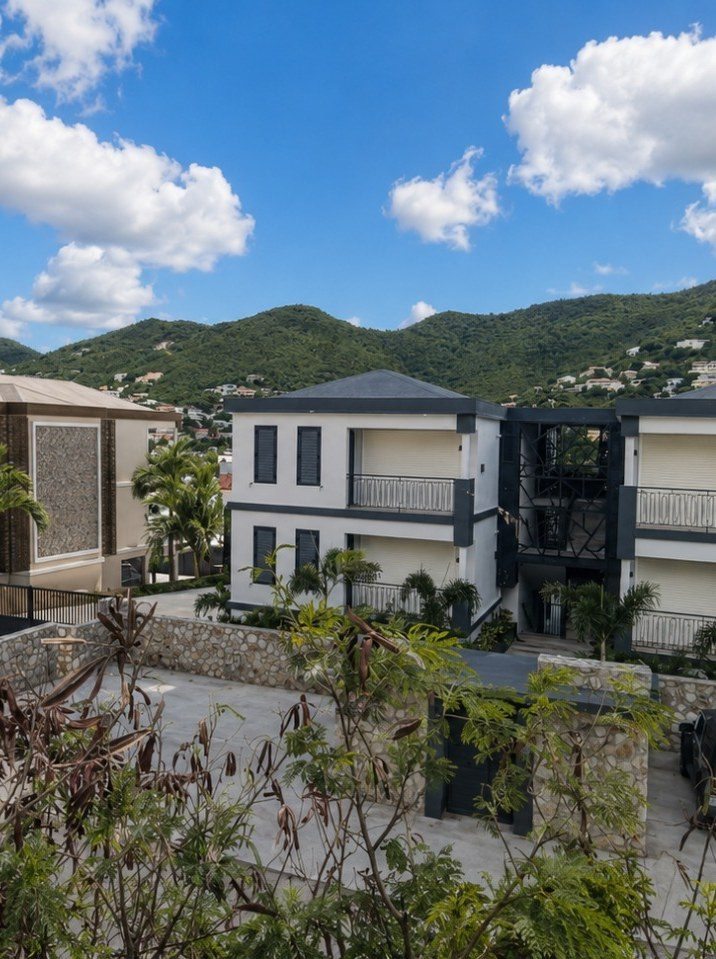 The completed apartment building on lot 1